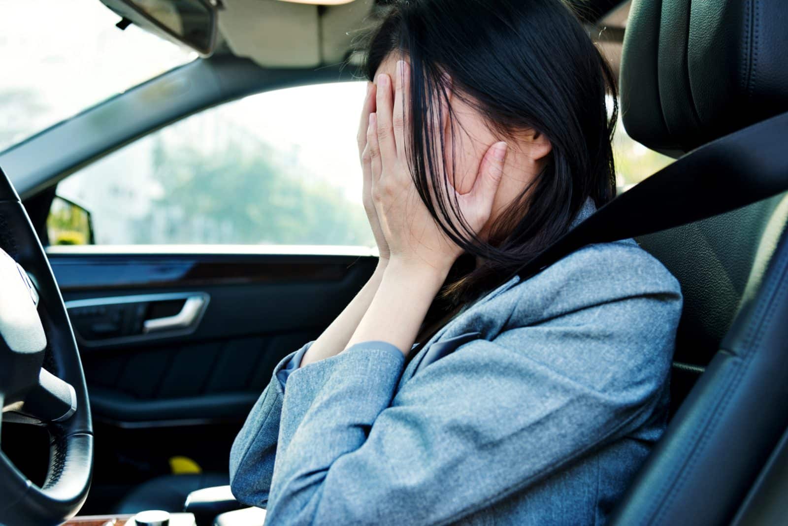 Sad businesswoman driver sitting in car
