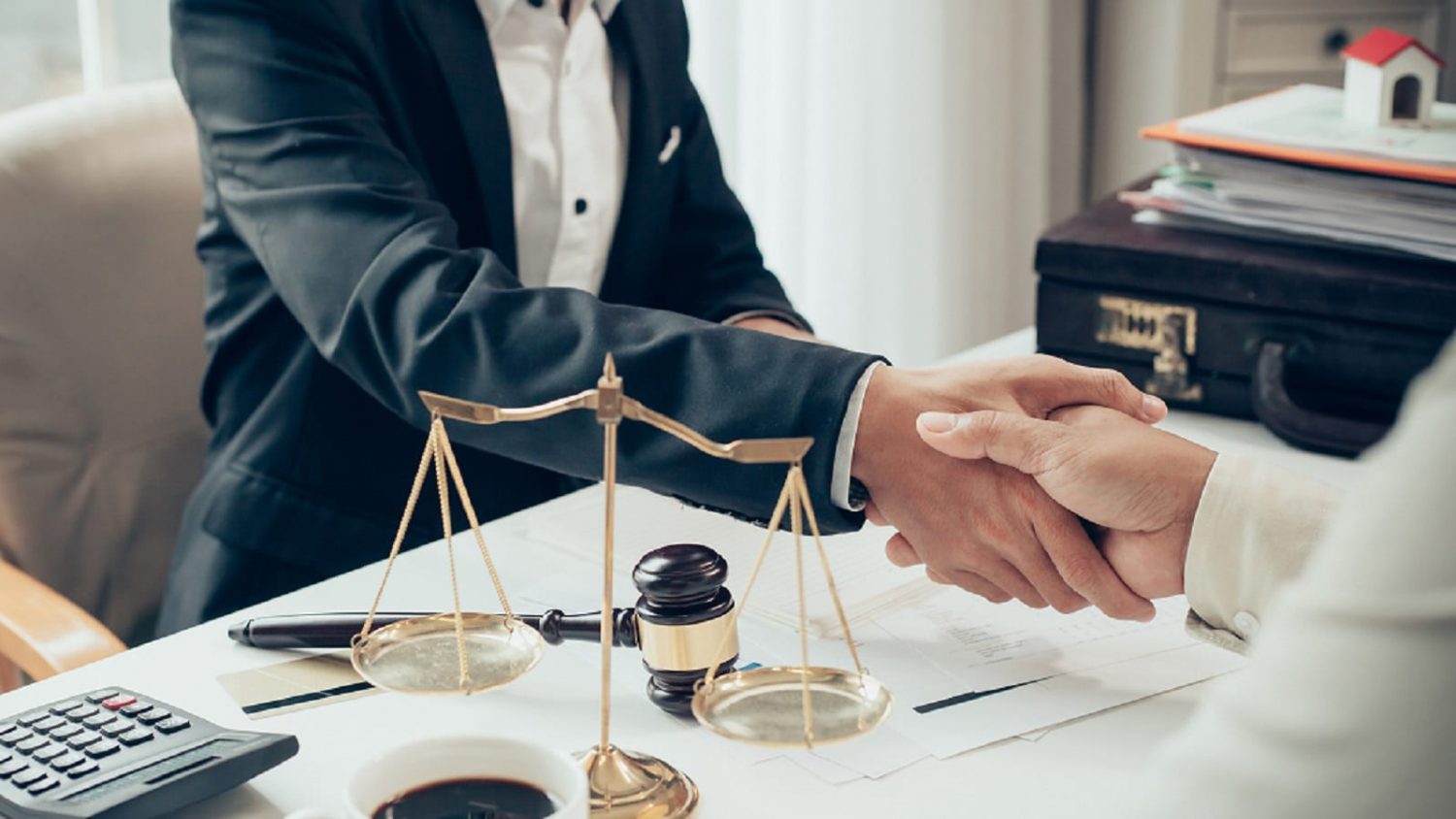 Lawyer Shaking Hands With A Client Stock Photo
