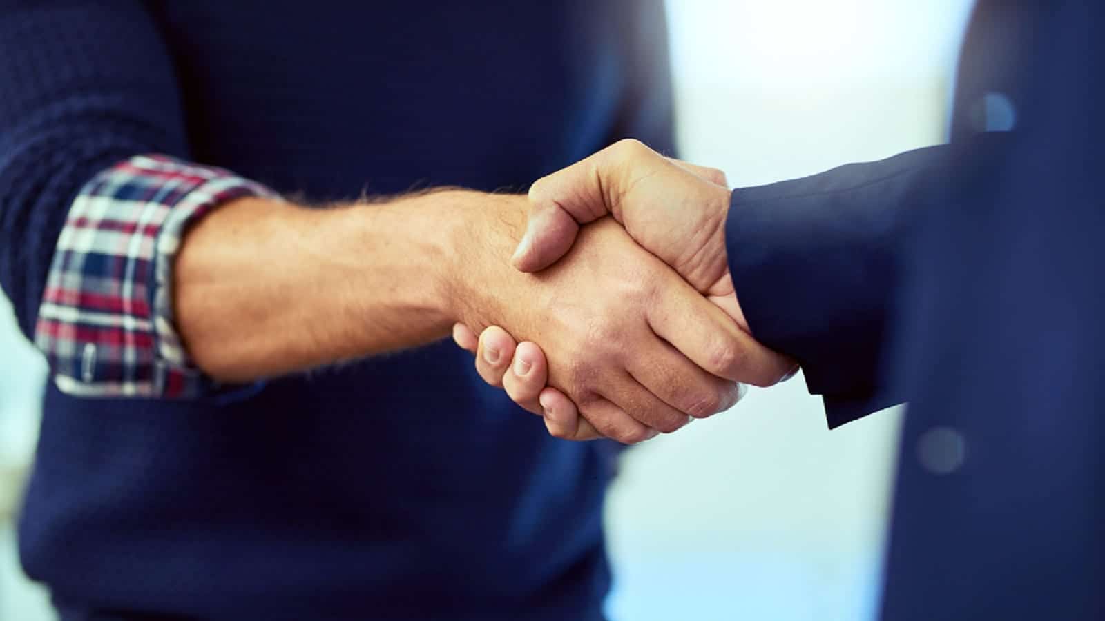 Lawyer Shaking Hands With A Client Stock Photo