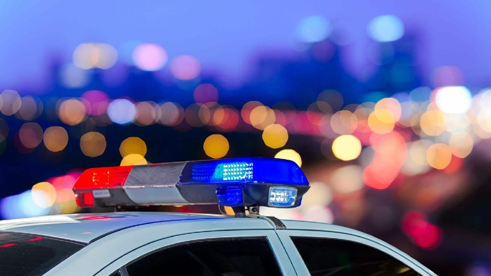 Parked Police Cruiser At Night Stock Photo