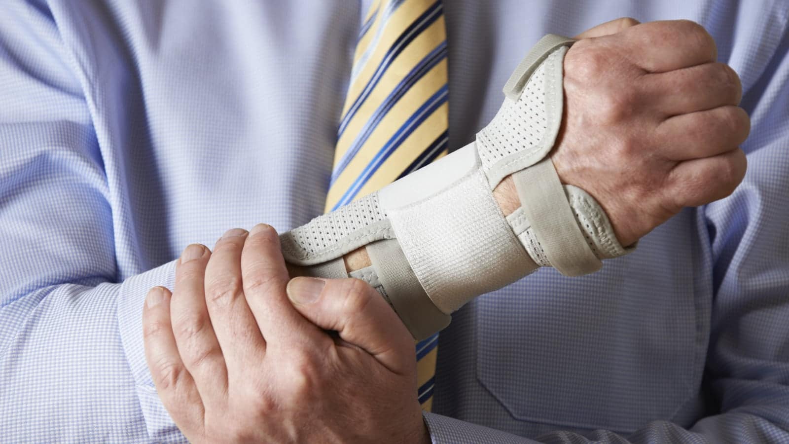 Businessman Suffering With Repetitive Strain Injury Stock Photo