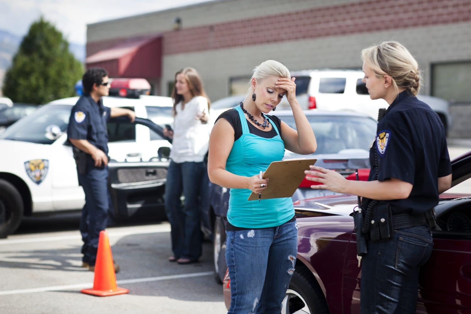A woman giving a statement to a police officer after a car accident.